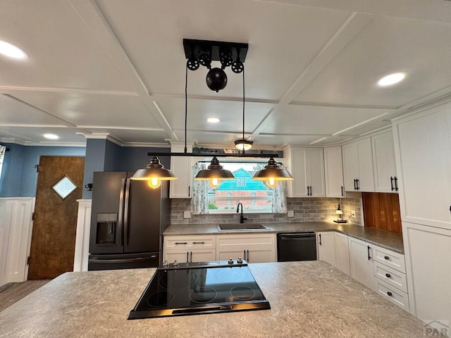 303 S Animas St, Trinidad, CO 81082 - kitchen featuring refrigerator with ice dispenser, dishwasher, healthy amount of natural light, cooktop, and recessed lighting