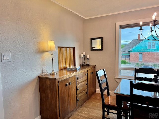 303 S Animas St, Trinidad, CO 81082 - dining room featuring light wood-style floors and crown molding