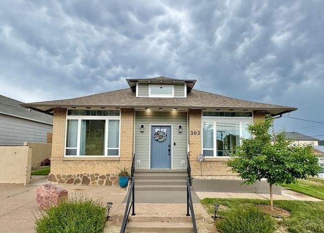 303 S Animas St, Trinidad, CO 81082 - bungalow-style home with brick siding and roof with shingles