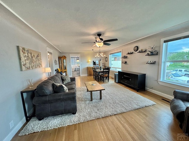 303 S Animas St, Trinidad, CO 81082 - living area featuring wood finished floors, a ceiling fan, and a textured ceiling