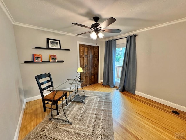 303 S Animas St, Trinidad, CO 81082 - living area featuring ceiling fan, wood finished floors, and crown molding