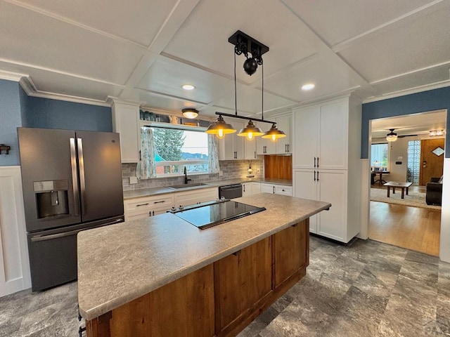 303 S Animas St, Trinidad, CO 81082 - kitchen with black appliances, coffered ceiling, white cabinetry, light countertops, and recessed lighting