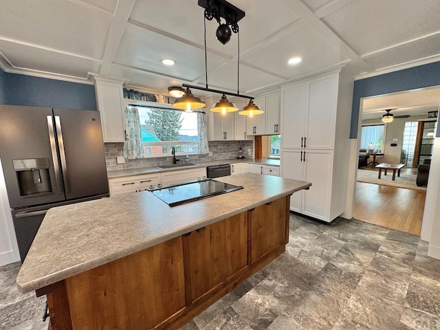 303 S Animas St, Trinidad, CO 81082 - kitchen featuring stainless steel fridge, coffered ceiling, white cabinets, decorative backsplash, and light countertops