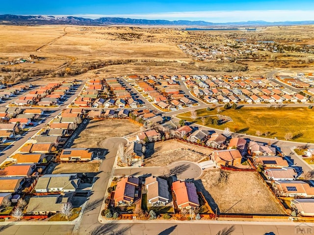 drone / aerial view with a residential view and a mountain view