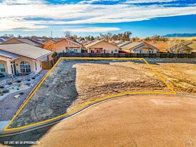 drone / aerial view with a residential view and a mountain view