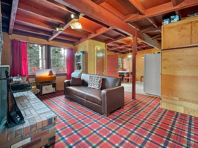1005 County Road 132, Westcliffe, CO 81252 - living area featuring beam ceiling, coffered ceiling, carpet flooring, and wooden walls