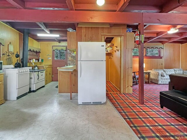 1005 County Road 132, Westcliffe, CO 81252 - kitchen featuring white appliances, wooden walls, beam ceiling, coffered ceiling, and washer / clothes dryer