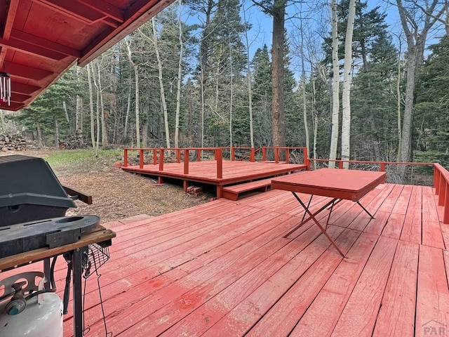 1005 County Road 132, Westcliffe, CO 81252 - wooden terrace with grilling area and a forest view