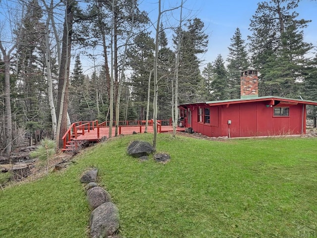 1005 County Road 132, Westcliffe, CO 81252 - view of grassy yard with a wooden deck