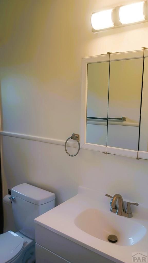 bathroom with vanity and toilet