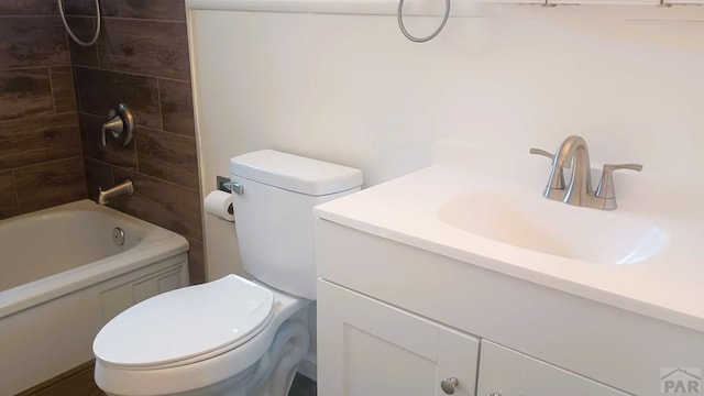 full bath with toilet,  shower combination, and vanity