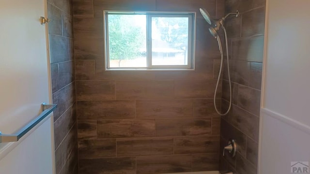 bathroom with tiled shower