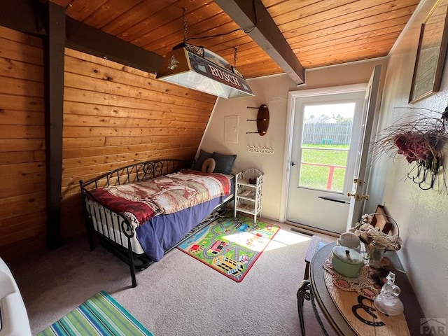 carpeted bedroom featuring access to exterior, wood ceiling, and vaulted ceiling with beams