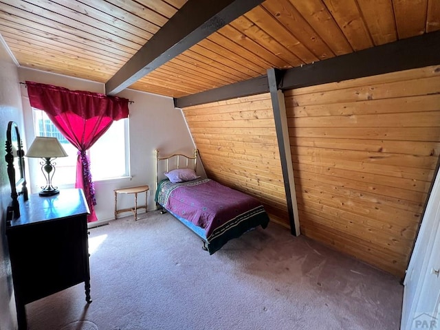 unfurnished bedroom featuring carpet, wood ceiling, wood walls, and beamed ceiling