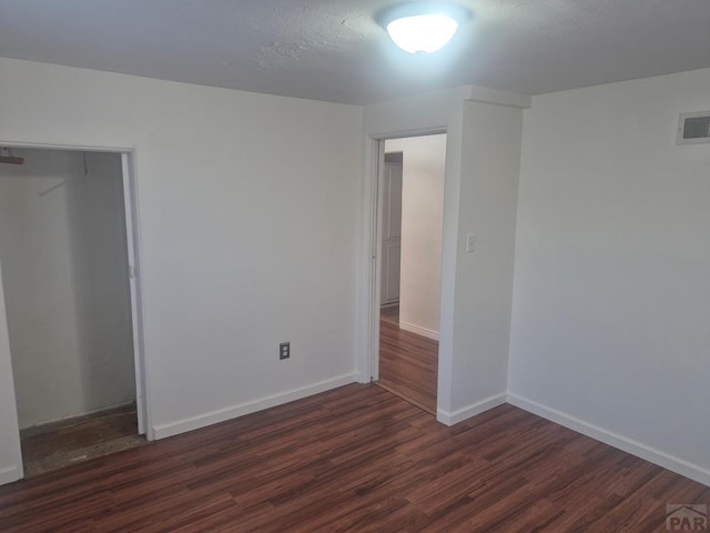 1122 Raton Ave, La Junta, CO 81050 - unfurnished bedroom with wood finished floors and a closet