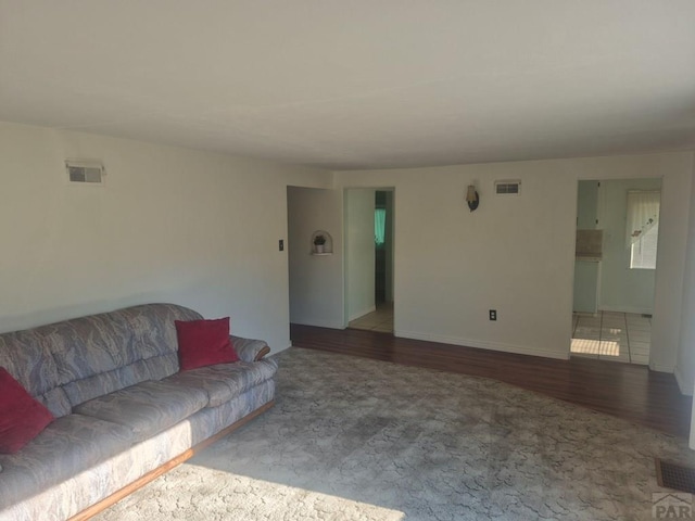 1122 Raton Ave, La Junta, CO 81050 - carpeted living room with wood finished floors