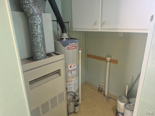 1122 Raton Ave, La Junta, CO 81050 - utility room featuring water heater and heating unit