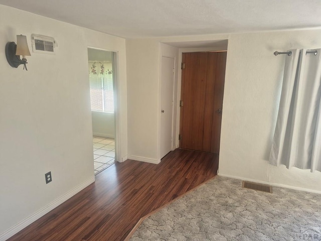 1122 Raton Ave, La Junta, CO 81050 - unfurnished room featuring wood finished floors and baseboards