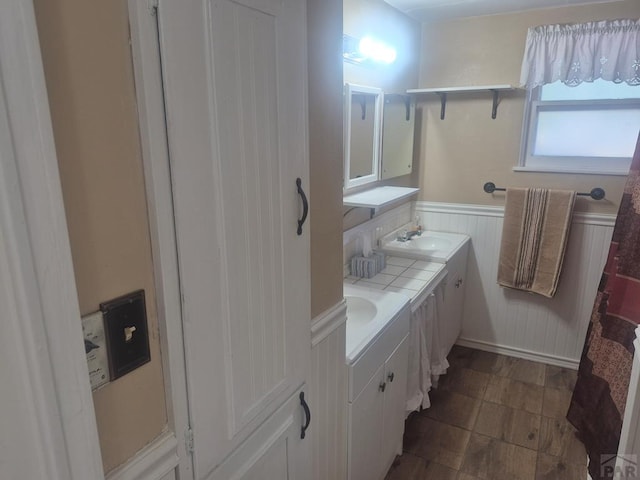 1122 Raton Ave, La Junta, CO 81050 - bathroom with wainscoting and double vanity