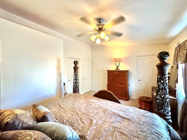 4147 Outlook Blvd Unit F, Pueblo, CO 81008 - bedroom featuring a textured ceiling, carpet flooring, ceiling fan, and baseboards