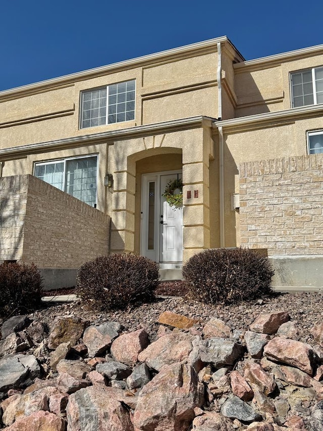 4147 Outlook Blvd Unit F, Pueblo, CO 81008 - doorway to property featuring stucco siding