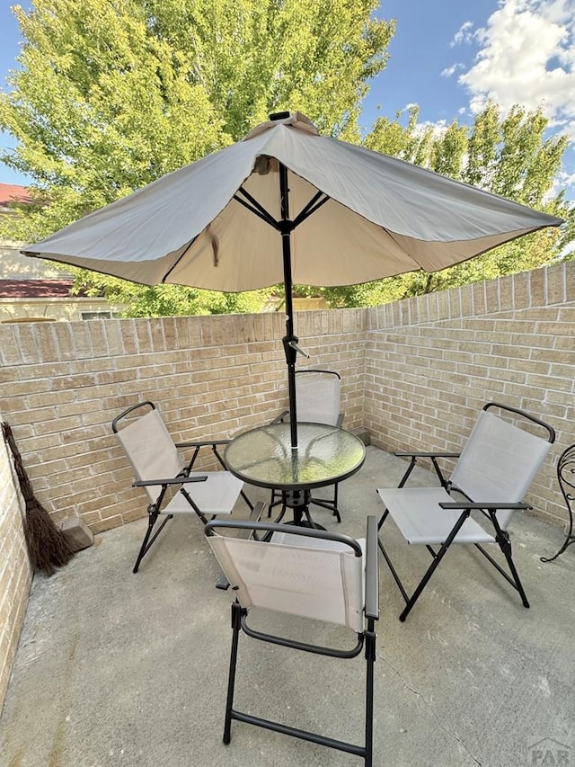 4147 Outlook Blvd Unit F, Pueblo, CO 81008 - view of patio featuring outdoor dining space