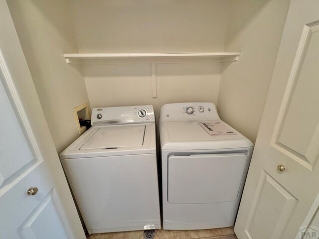 4147 Outlook Blvd Unit F, Pueblo, CO 81008 - laundry area with washing machine and dryer and laundry area