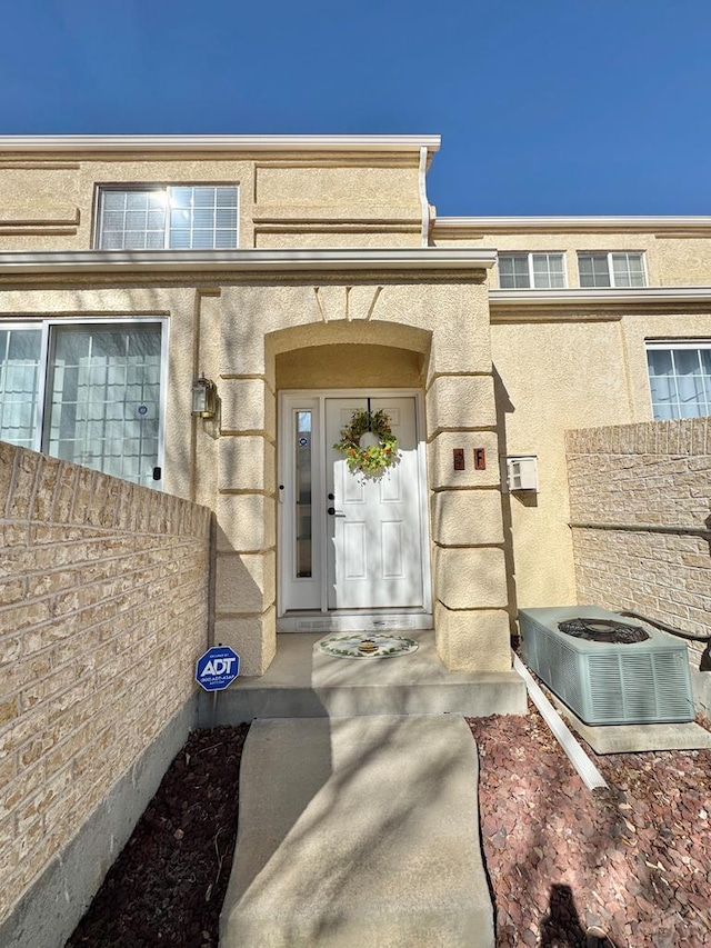 4147 Outlook Blvd Unit F, Pueblo, CO 81008 - doorway to property with central AC and fence