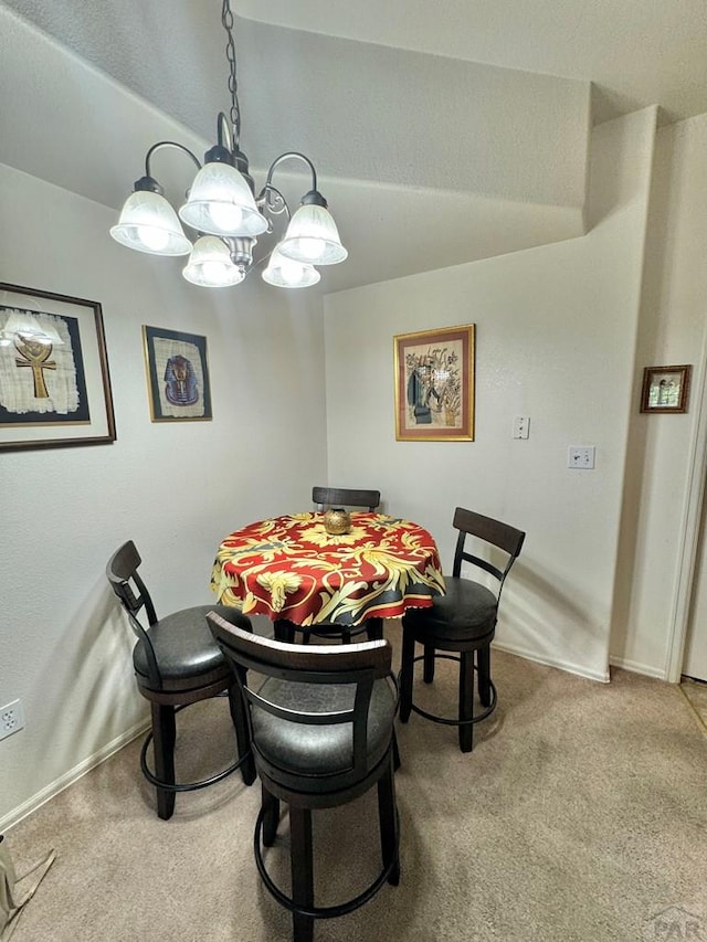 4147 Outlook Blvd Unit F, Pueblo, CO 81008 - dining space featuring carpet floors, baseboards, and a chandelier