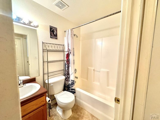 4147 Outlook Blvd Unit F, Pueblo, CO 81008 - bathroom with vanity, visible vents, toilet, shower / bath combo with shower curtain, and a textured wall