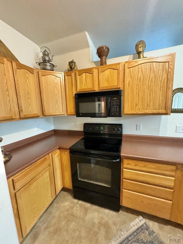 4147 Outlook Blvd Unit F, Pueblo, CO 81008 - kitchen featuring black appliances
