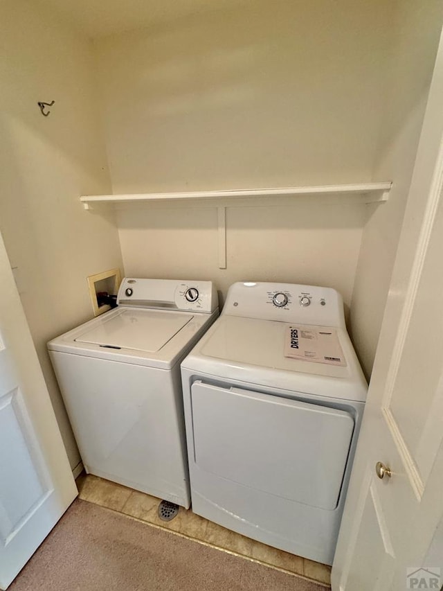 4147 Outlook Blvd Unit F, Pueblo, CO 81008 - clothes washing area with washer and dryer and laundry area