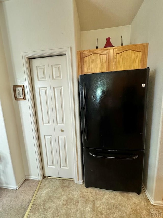 4147 Outlook Blvd Unit F, Pueblo, CO 81008 - interior details with baseboards and freestanding refrigerator