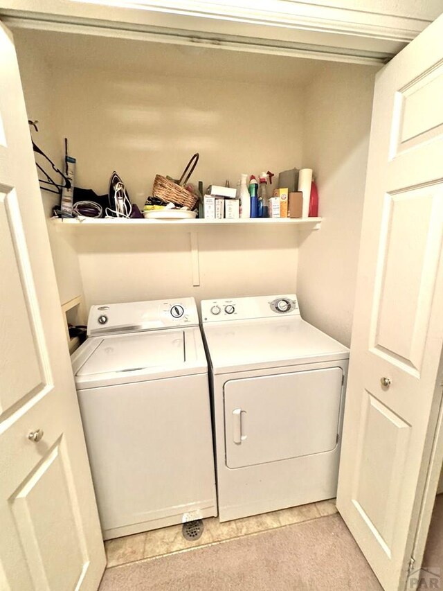 4147 Outlook Blvd Unit F, Pueblo, CO 81008 - clothes washing area with independent washer and dryer and laundry area