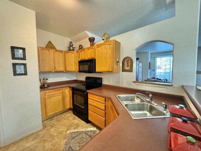 4147 Outlook Blvd Unit F, Pueblo, CO 81008 - kitchen featuring a sink and black appliances