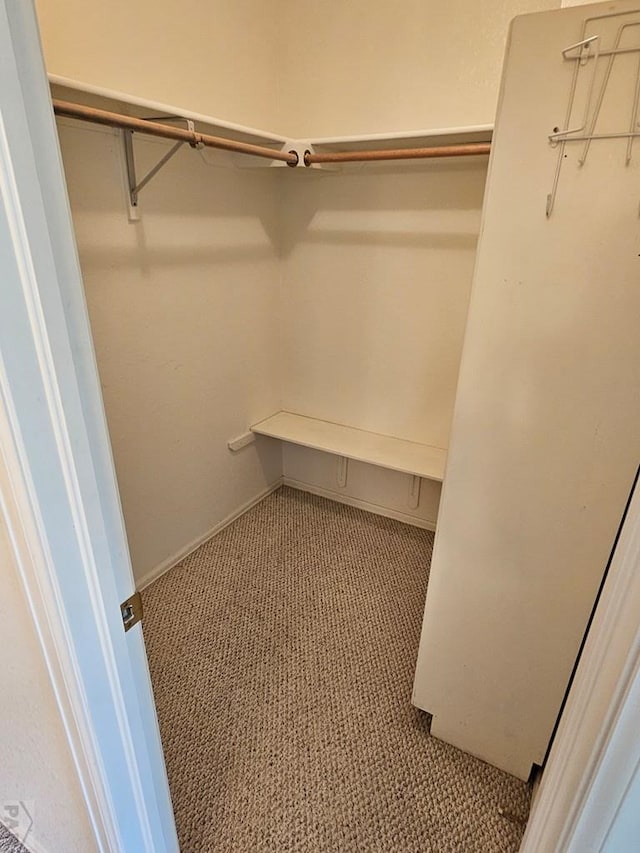 spacious closet featuring tile patterned floors