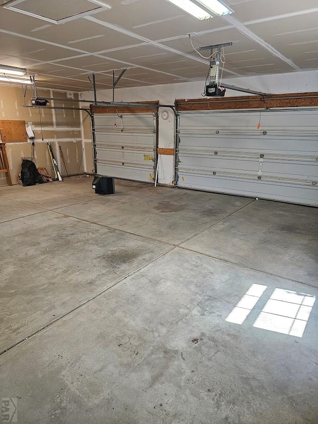 garage featuring a garage door opener