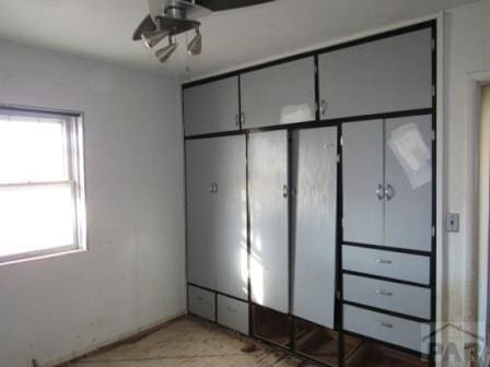 unfurnished bedroom featuring multiple windows