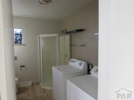 laundry room featuring laundry area and washing machine and clothes dryer