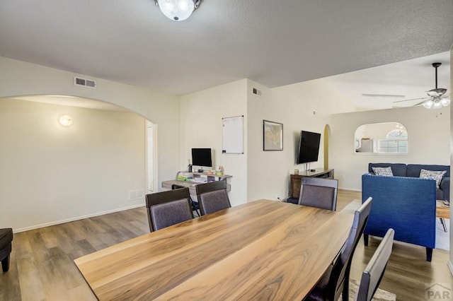 5019 Sage St, Pueblo, CO 81005 - dining area with arched walkways, wood finished floors, and ceiling fan