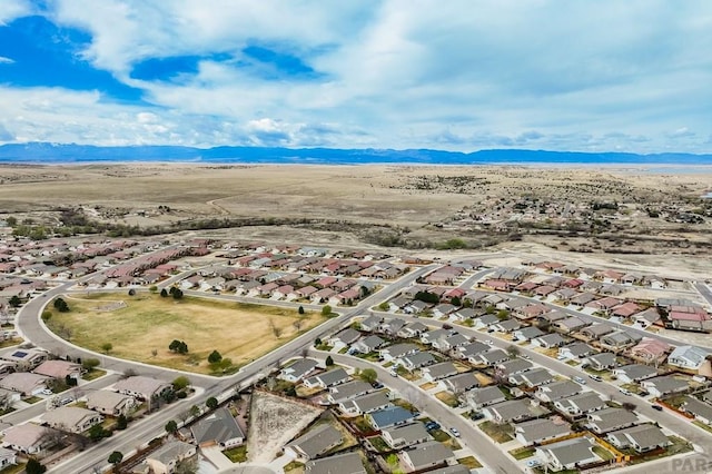 5019 Sage St, Pueblo, CO 81005 - aerial view of property and surrounding area featuring nearby suburban area and a mountain backdrop