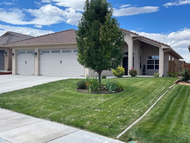 view of front of house with a tiled roof, an attached garage, and stucco siding