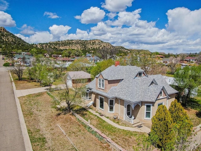 birds eye view of property with a mountain view