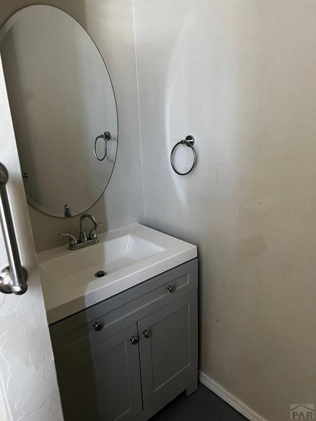 bathroom featuring vanity and baseboards