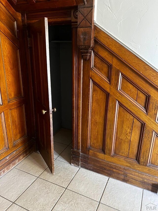 corridor with light tile patterned floors