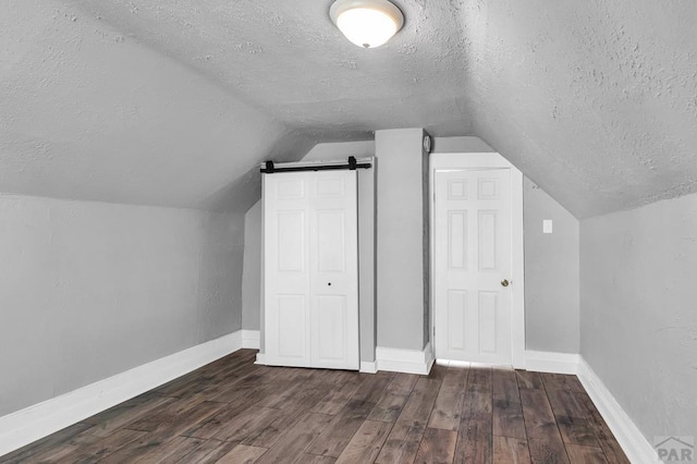 1131 Pine St, Pueblo, CO 81004 - bonus room with baseboards, wood finished floors, and a textured ceiling