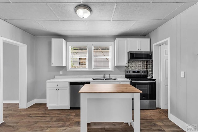 1131 Pine St, Pueblo, CO 81004 - kitchen featuring white cabinets, stainless steel appliances, wood counters, and a sink