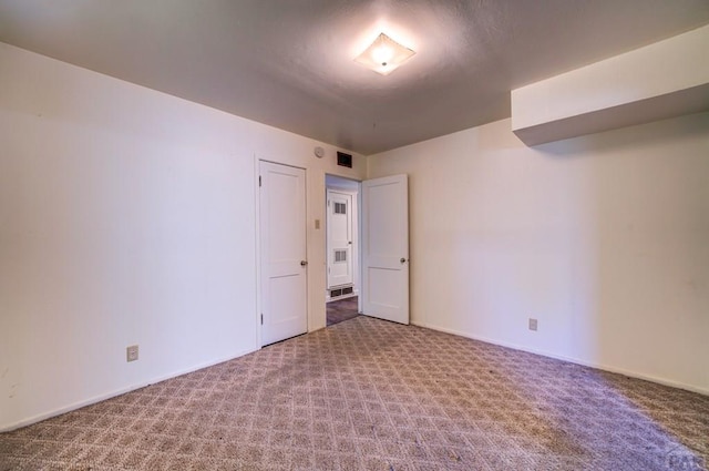2621 Begonia St, Pueblo, CO 81005 - empty room featuring carpet flooring, baseboards, and visible vents