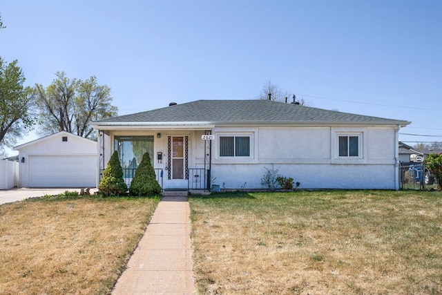 2621 Begonia St, Pueblo, CO 81005 - view of front of property with an outbuilding, covered porch, a front yard, fence, and a garage