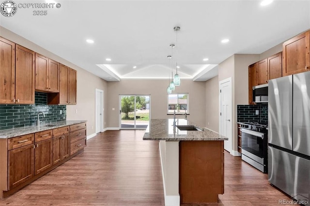 3010 Grandview Ave, Canon City, CO 81212 - kitchen featuring a raised ceiling, stainless steel appliances, wood finished floors, backsplash, and recessed lighting